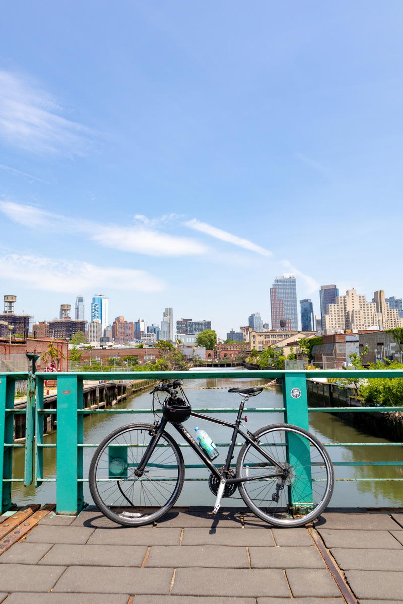 A bike leaning against a railing in NYC.