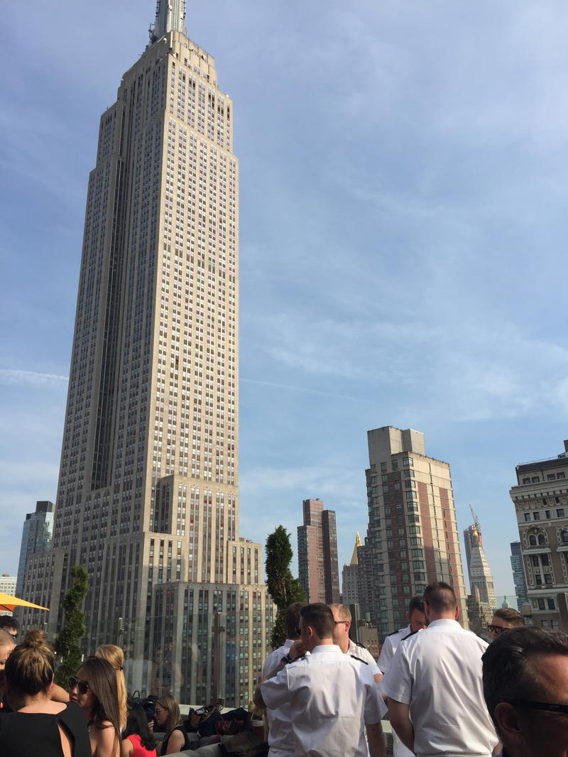 A crowd in NYC gathered near the Empire State Building.