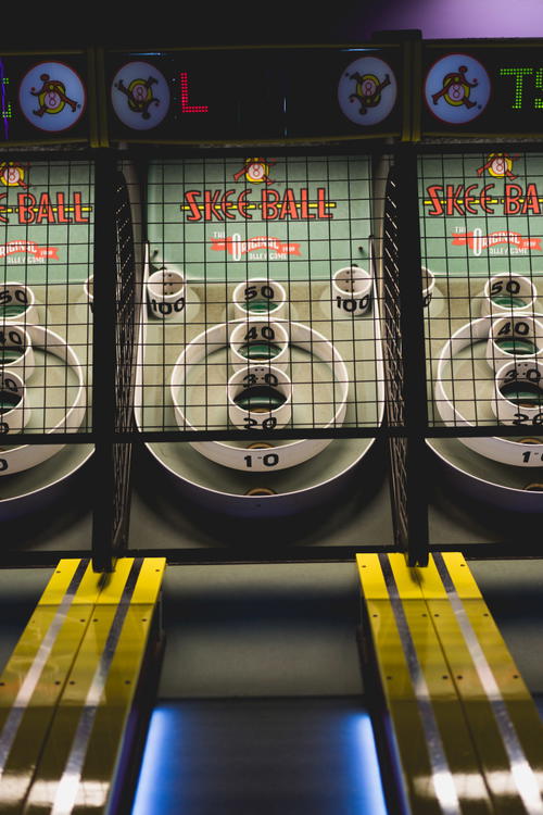 A yellow screen pinball machine in Coney Island.