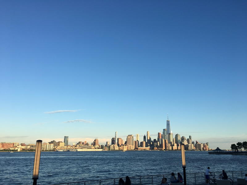 A scenic view of the NYC skyline from the water.