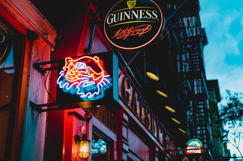 Neon signs during sunset in SoHo