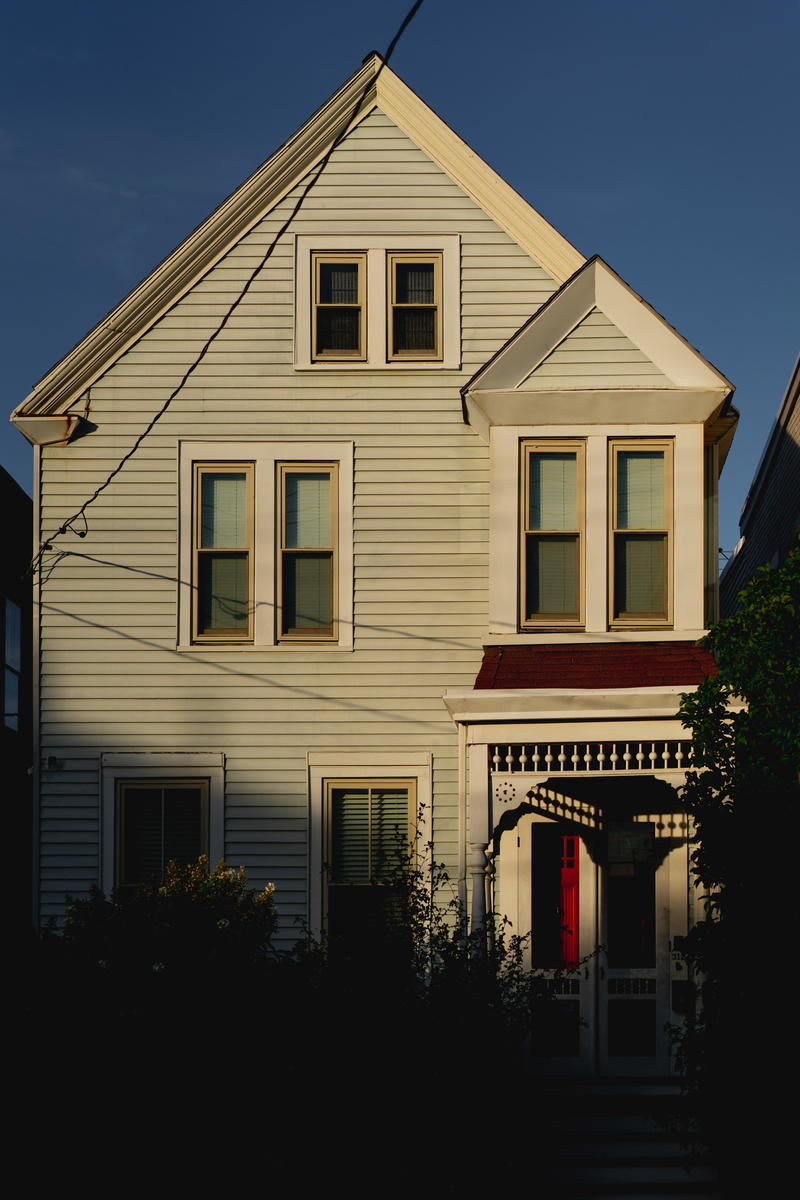 A house in New York with a red door.