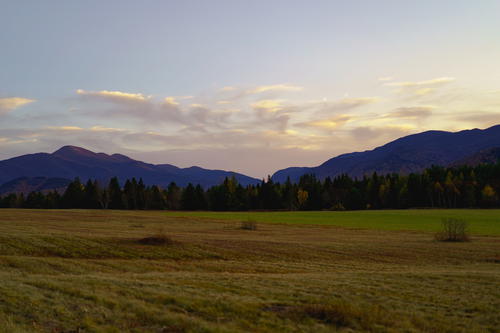 The sky over Lake Placid is cloudy.