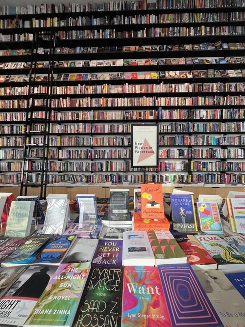 A room full of books in a New York City apartment.