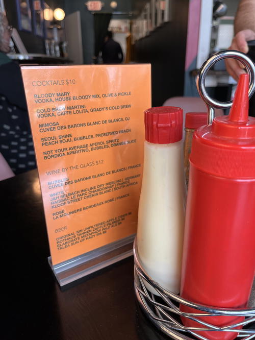 A Livingston Manor table with ketchup and mustard on it.