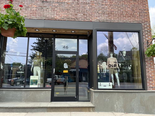 A storefront in Livingston Manor, New York with mannequins in front of it.