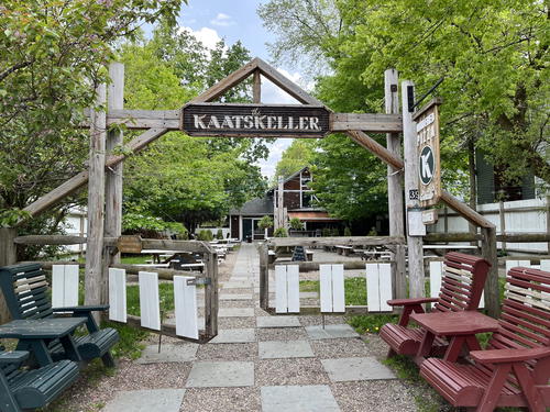 A wooden gate and bench in Livingston Manor.