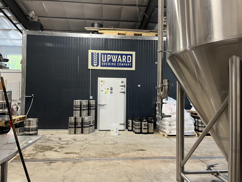 A Livingston Manor brewery with a large number of kegs and tanks.
