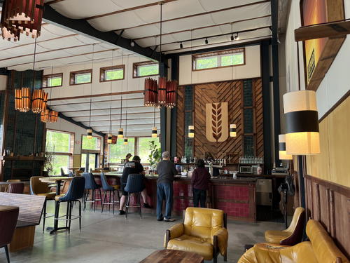 The interior of a restaurant in Livingston Manor with wooden tables and chairs.