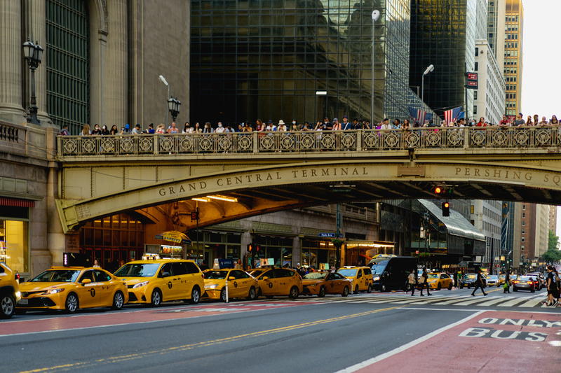 A bridge in NYC over a city street.