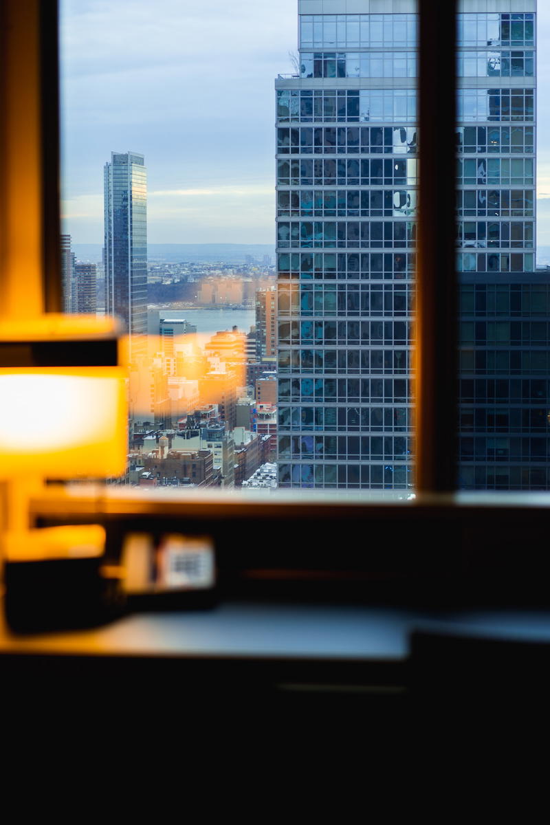 A window with a NYC view through it.
