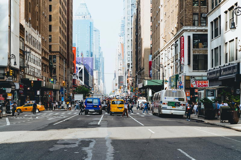 A busy city street in NYC with a lot of traffic.