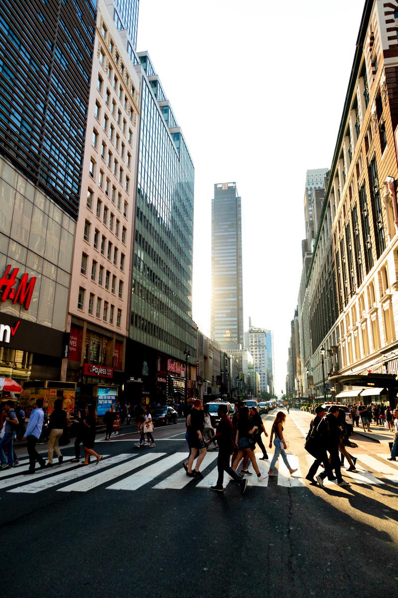 A group of people crossing a street in NYC.