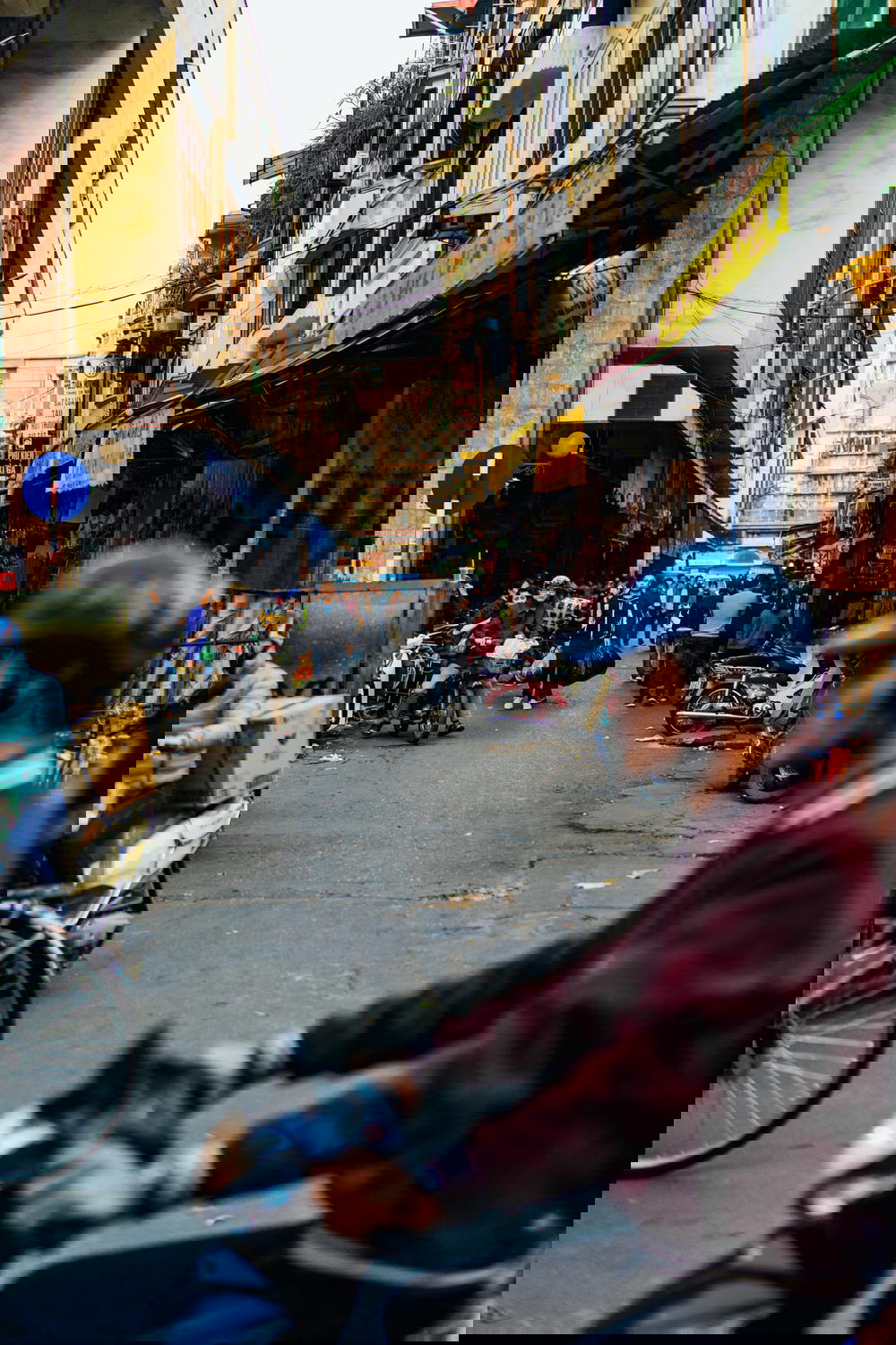 A man on a motorcycle in Hanoi, Vietnam.