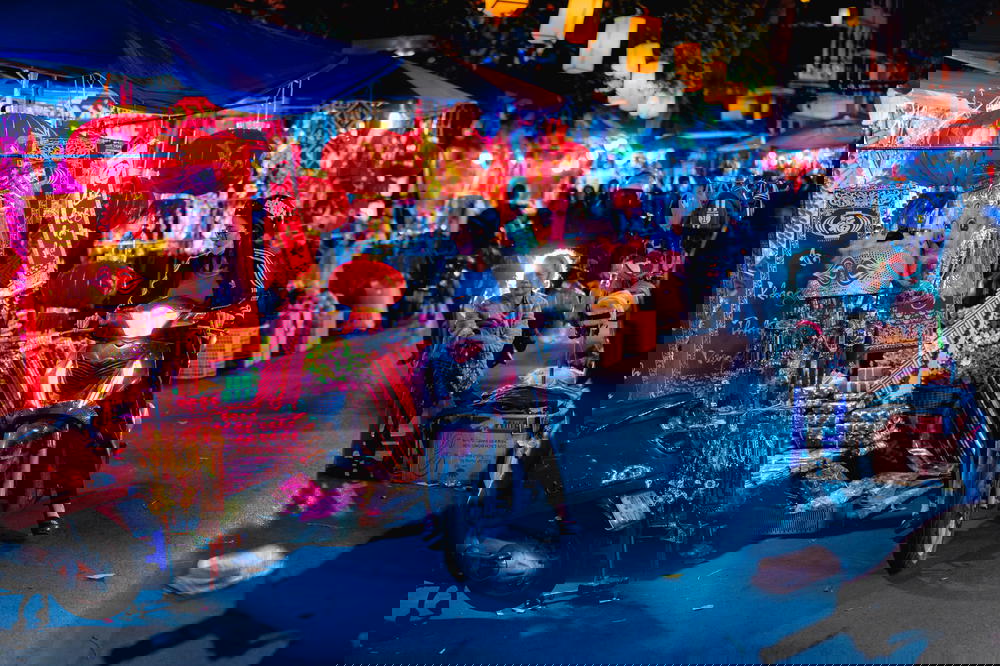 A bustling street in Hanoi, Vietnam filled with motorcycles.