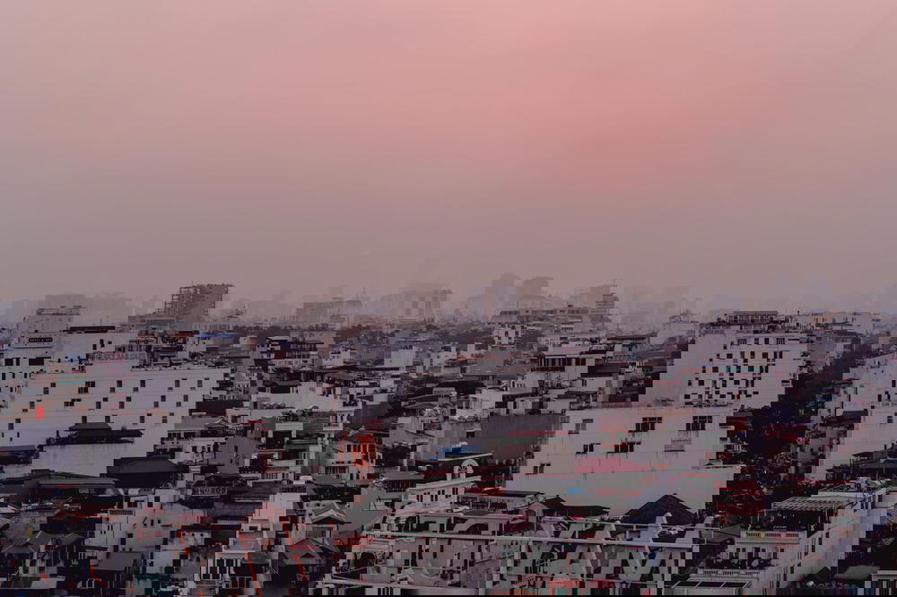 The sky of Hanoi, Vietnam is pink.