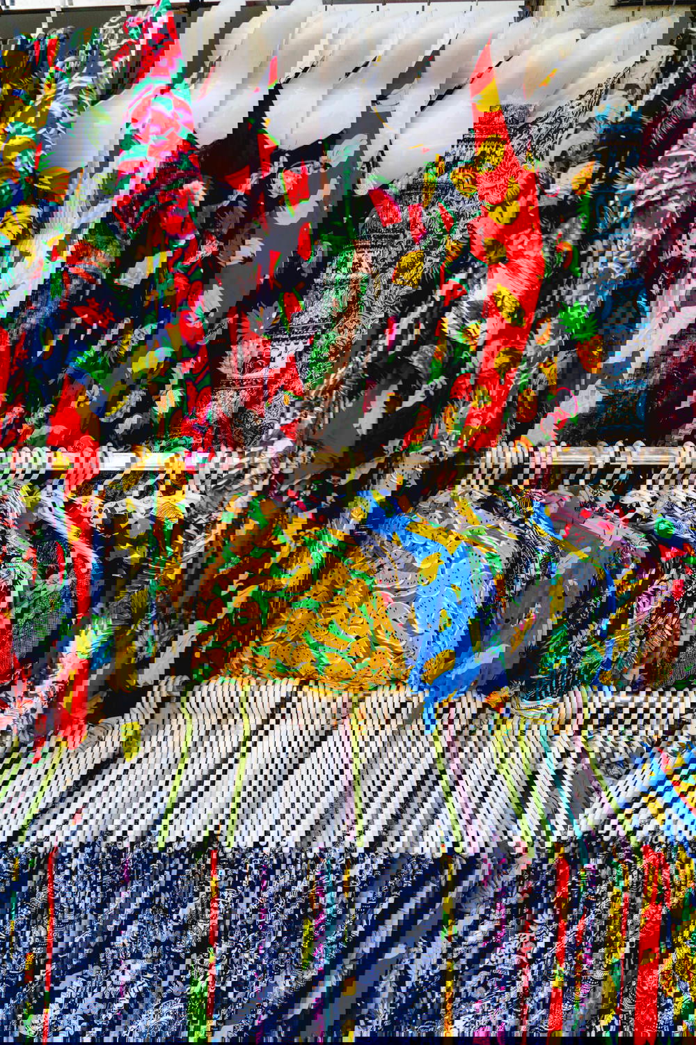 A rack of colorful clothes displayed in Hanoi, Vietnam.