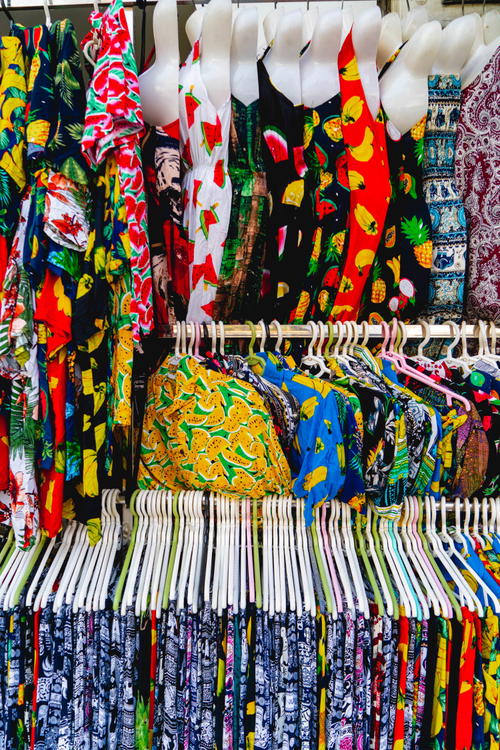 A rack of colorful clothes displayed in Hanoi, Vietnam.