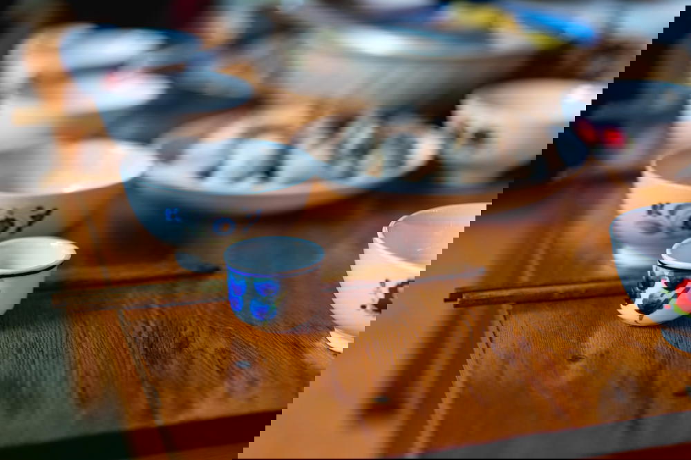 Tea cup on a table set for a meal