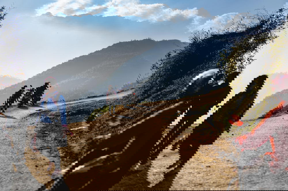 Motorbikes parked on the side of a dirt road near Sapa, Vietnam