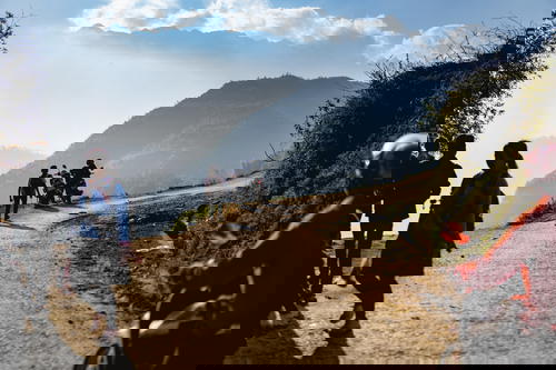 A group of people walking down a road in Vietnam.