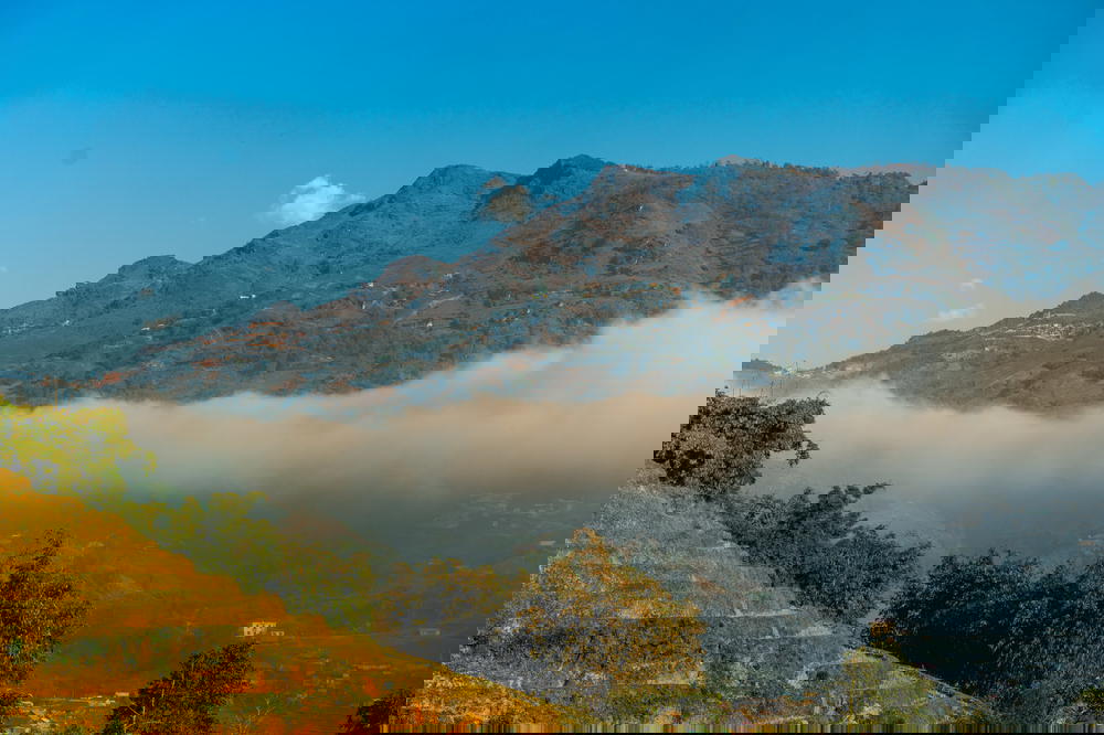 A view of the village of Sapa, Vietnam with a mountain in the background.