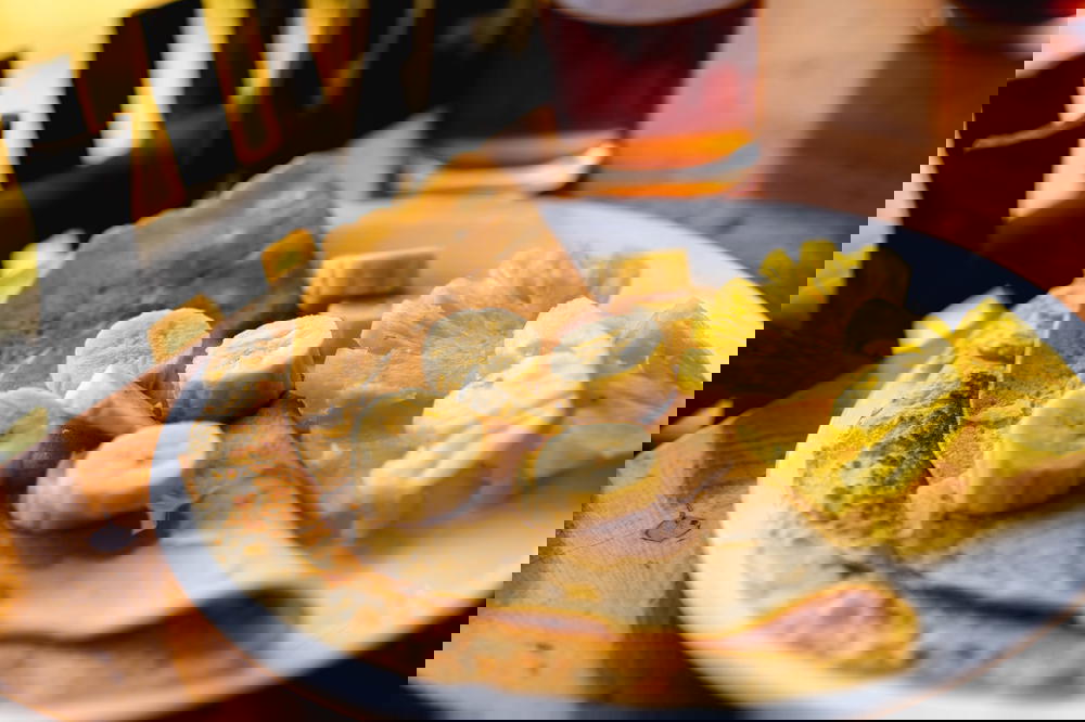 A plate of food on a wooden table in Vietnam.