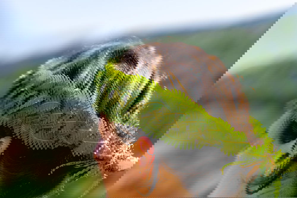 A woman wearing a fern headband in Sapa, Vietnam.