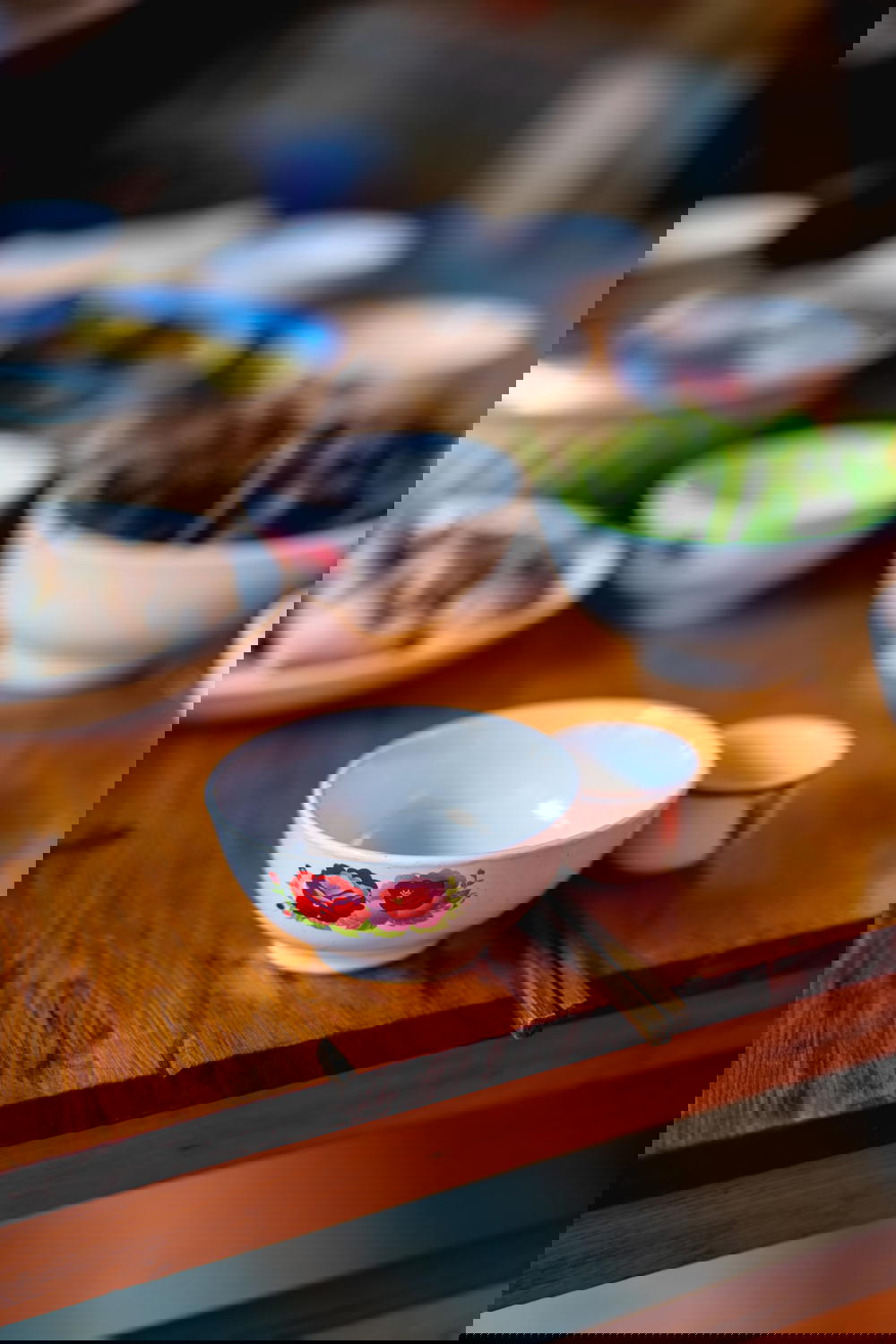 Small tea cups and chopsticks on a table in Sapa