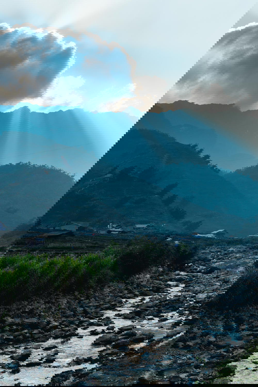 Sun bands against a mountain in a village near Sapa